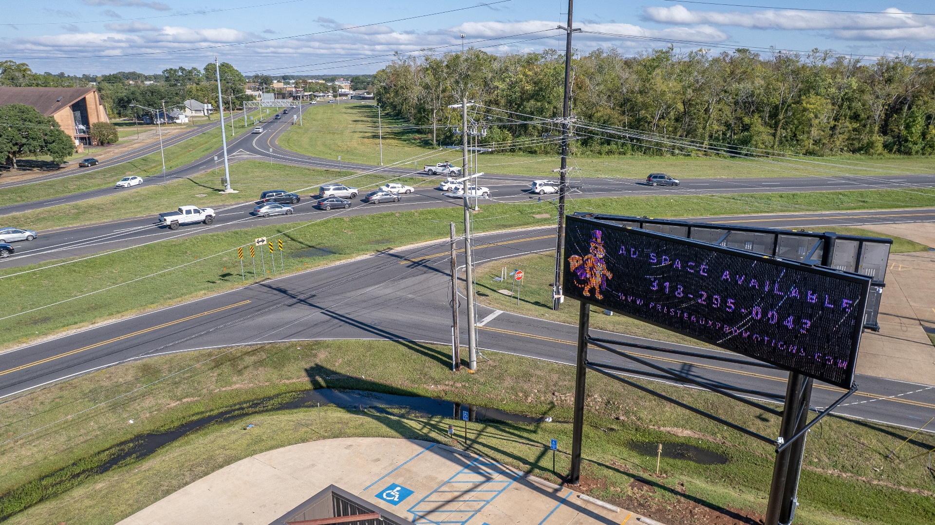 Presteaux Promotions digital billboard with ad space available at busy Alexandria, LA intersection